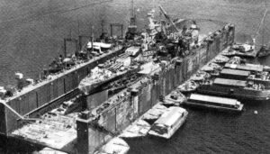 ABSD 1 (Advanced Base Section Dock 1) in Pearl Harbor, with USS Utah in dry dock.