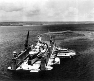 WWII ABSD floating dry dock repairing a damaged battleship