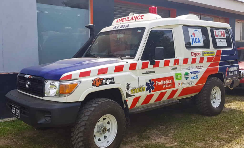 Alma ambulance vehicle, a white 4x4 with red and white stripes and "AMBULANCE ALMA" text.