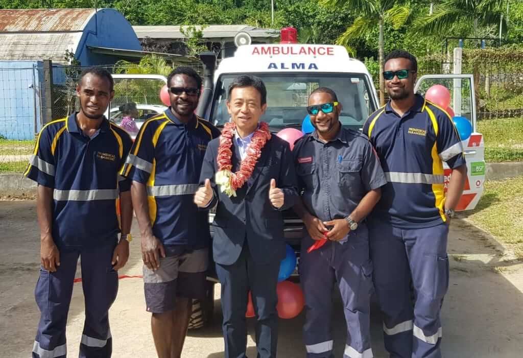 Alma Ambulance donation: Dignitaries and ambulance crew celebrate.