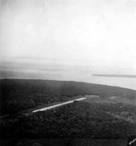 Aerial view of a jungle airstrip, possibly related to Bomber #2 history.