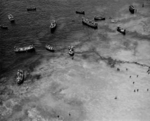 Aerial view of boats near a beach, possibly related to the Coolidge.