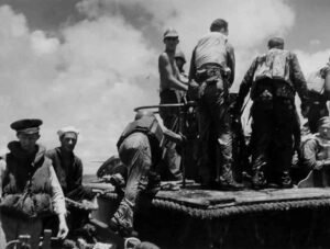 WWII sailors in life vests on a ship deck, historical Coolidge context