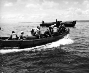 Coolidge landing craft carrying soldiers across choppy water