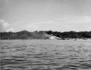 USS Coolidge shipwreck, a historical vessel submerged in shallow water.
