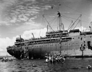 USS Coolidge passengers disembarking by rope net, WWII troopship