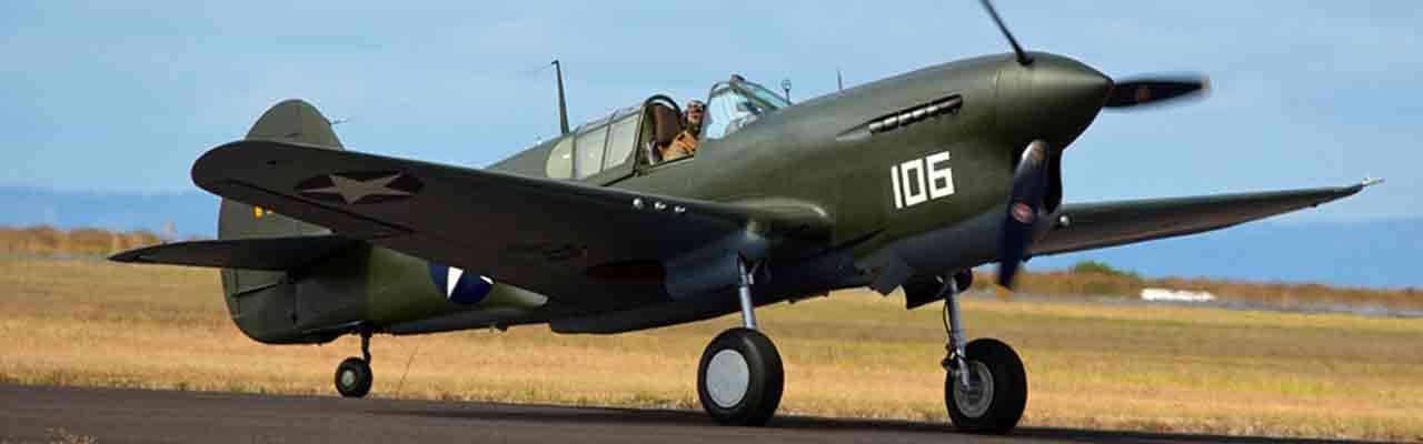 Curtiss P-40 Warhawk aircraft with number 106 on the fuselage, at Santo Base.