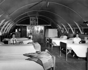 Nurses in a Quonset hut hospital ward, part of Historical Hospital #3.
