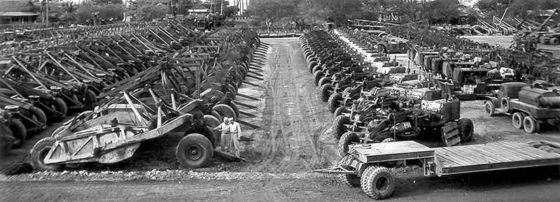 Million Dollar Point: Rows of abandoned heavy construction equipment, bulldozers, and trailers.