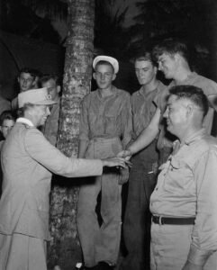 Eleanor Roosevelt greets servicemen in this historical photo.