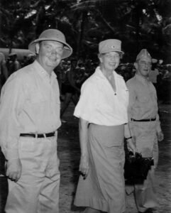 Franklin D. Roosevelt, a nurse, and a military officer in uniform.
