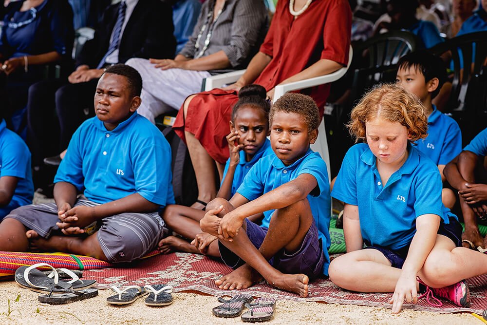 Children in blue shirts at Coolidge Commemoration event