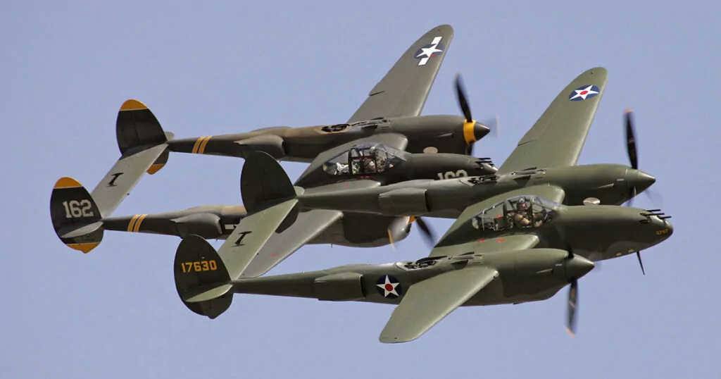 Three Lockheed P-38 Lightning fighter planes in flight