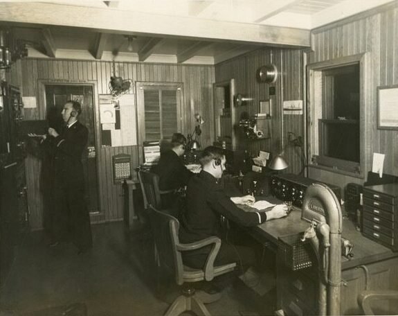 Coolidge era radio operators in a communications room