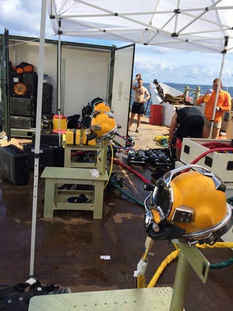 Divers and equipment on a boat deck, possibly related to Elwood J Euart.