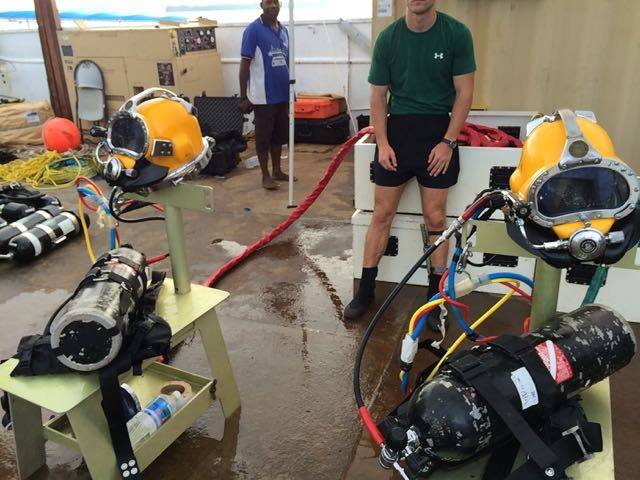 Elwood J Euart diving gear with divers preparing for underwater operations.
