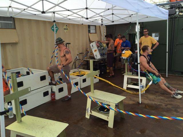 Elwood J Euart crew prepares equipment under a tent