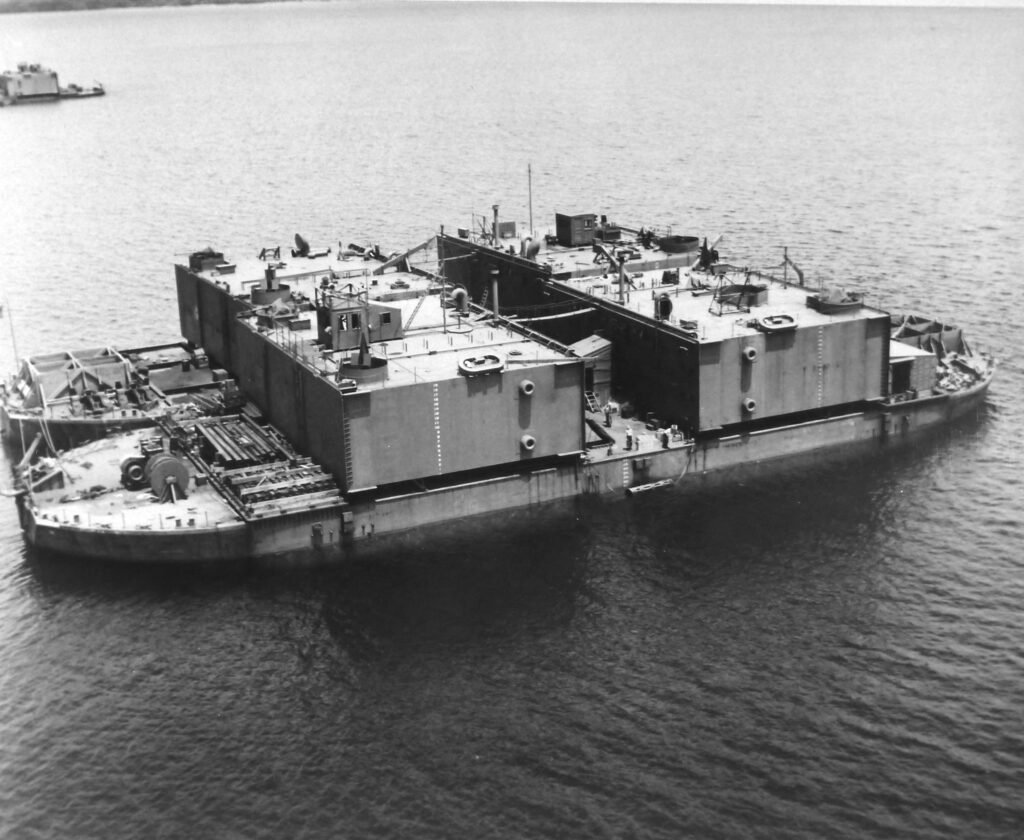 Floating dry dock structure with multiple compartments in calm water
