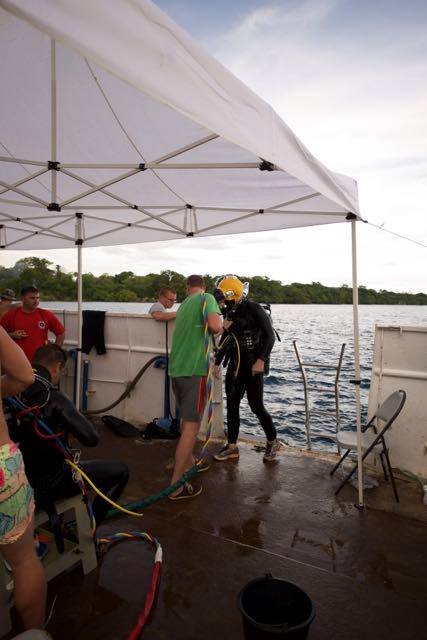 Scuba divers preparing for a dive from a boat, Elwood J Euart