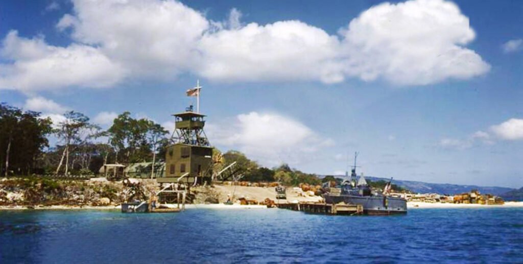 Naval airfield with watchtower and docked ship on a tropical island