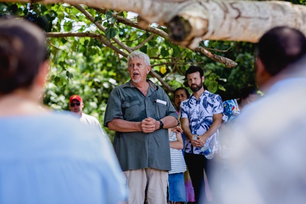 Man speaking at a Coolidge Commemoration event outdoors.