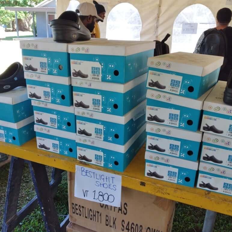 Stack of Bestlight shoes in boxes for sale, with price tag VT 1,800