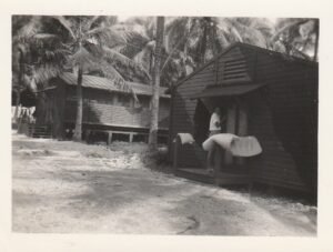 25th Infantry Division soldiers at tropical barracks with palm trees