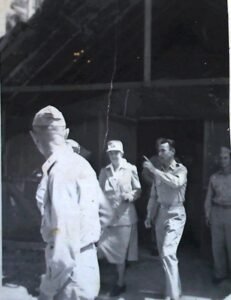 Historical 25th Infantry Division soldiers and a nurse in a building