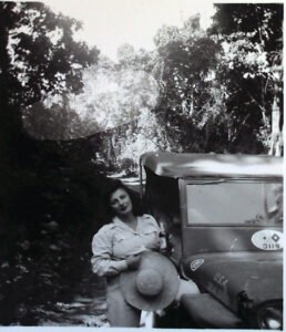 Woman in uniform with hat and jeep, 25th Division