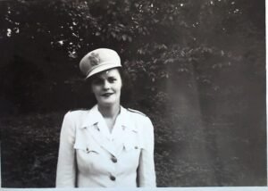 Woman in military uniform, historical context for the 25th.