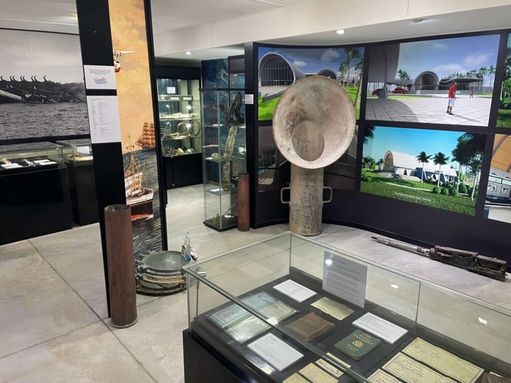 Museum exhibits: historical artifacts, ship models, and display cases with documents.