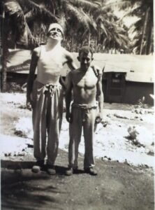 Two tall men from the 25th Infantry Division in a tropical setting.