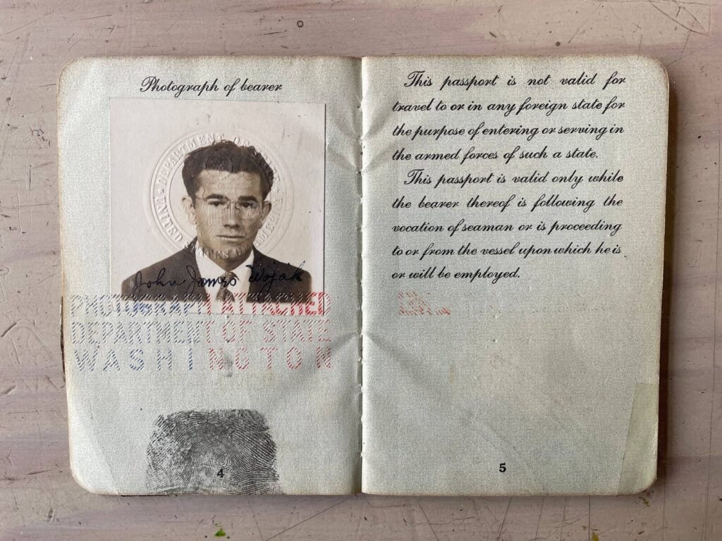 Open vintage US passport page with photograph and text